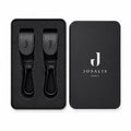Black leather Buggy clips with metal carabiner hooks, shown in a presentation matte black tin sitting tidily within foam inserts  